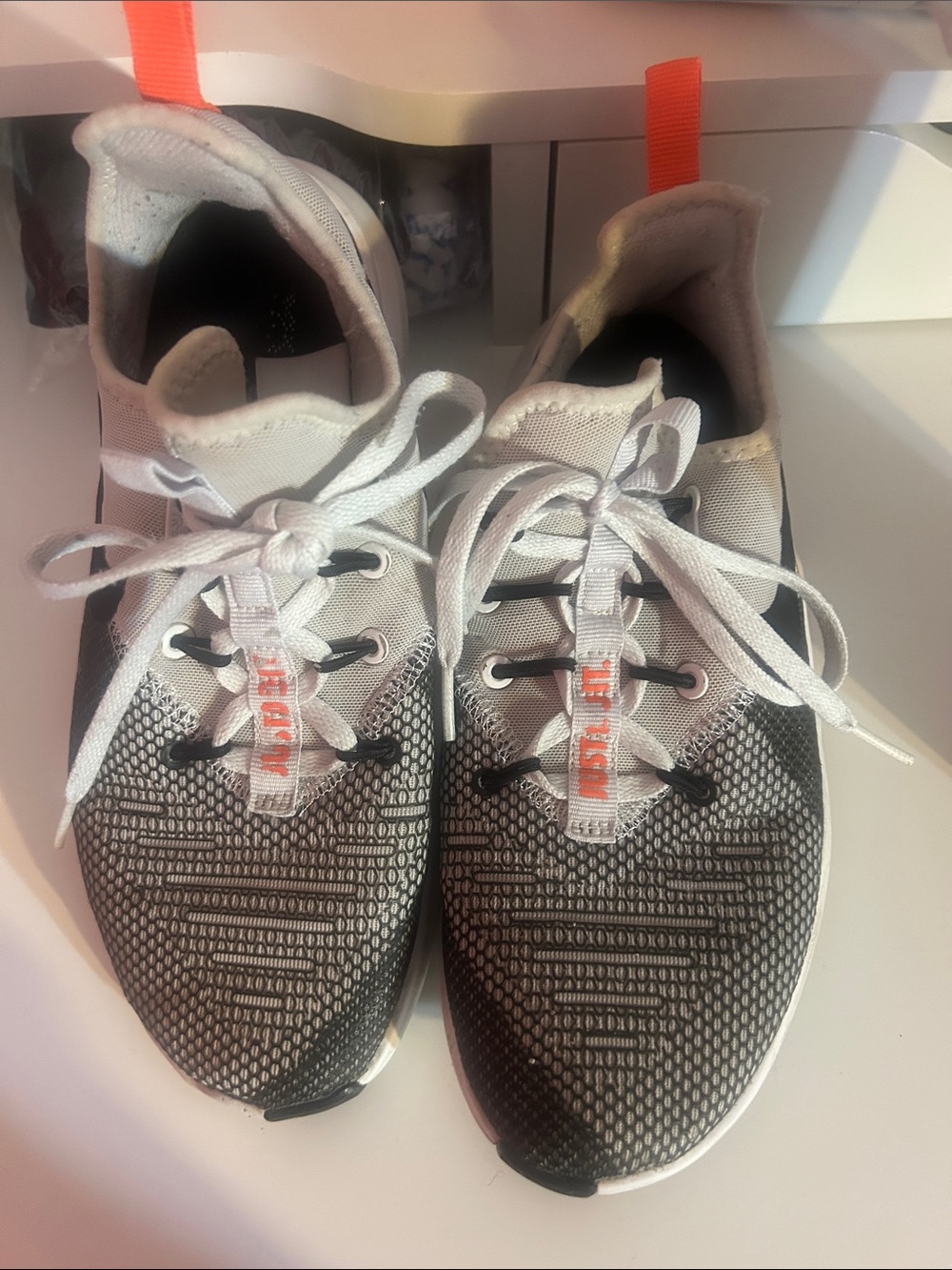 Nike Women's Black White Athletic Running Shoes with Orange Pull Tabs